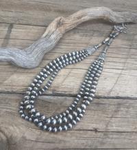 Necklace: triple std Navajo pearls, signature cones by Myra Gadson